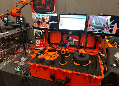 The Iron Rodent CTF station at the Aerospace Village, with screens and the demonstrator case